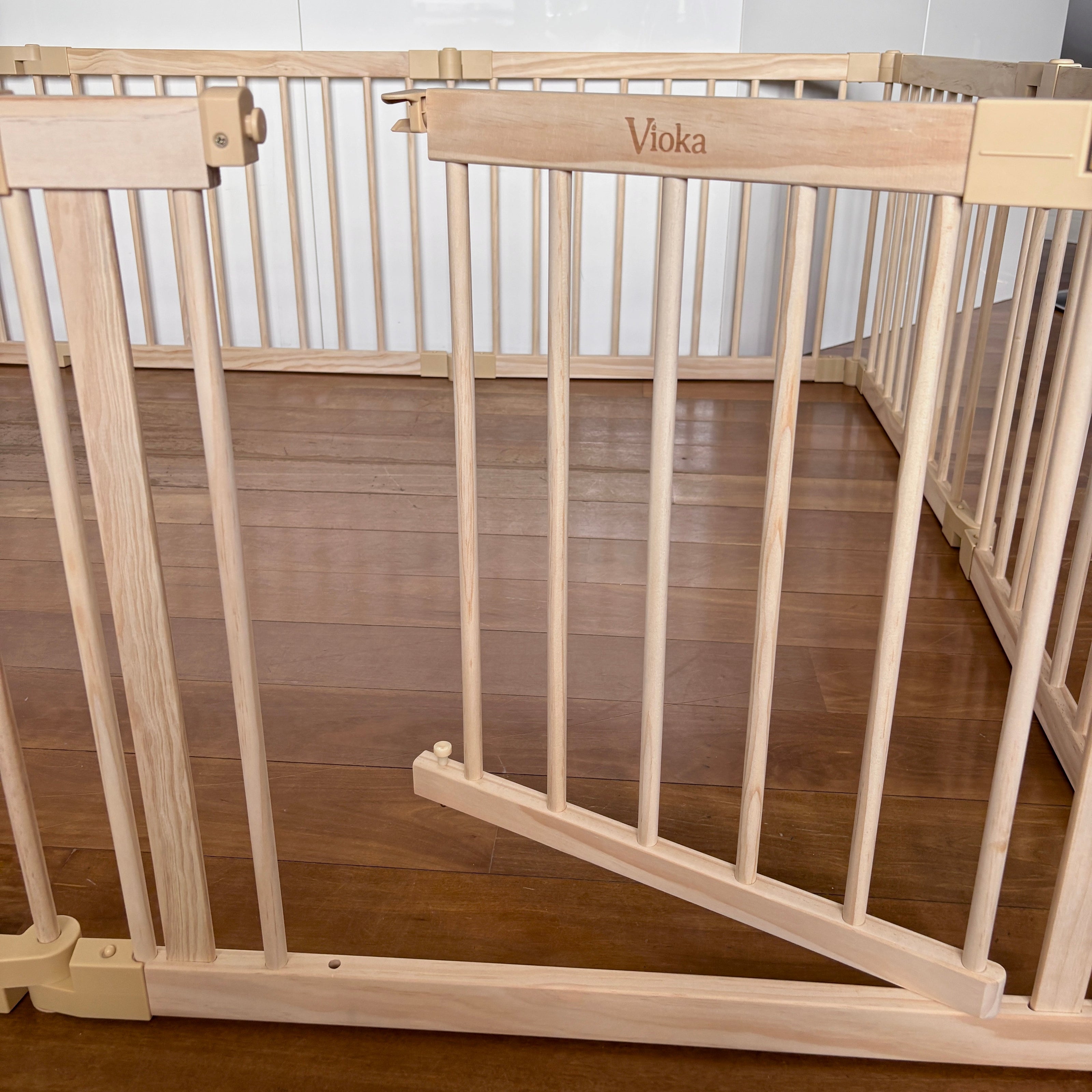 Wooden playpen gate lock close up